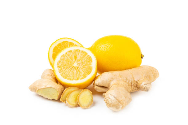 istock Fresh ginger and lemon isolated on white background. Sliced ​​ginger. Ginger root. Traditional alternative medicine, healing tea for immunity. Close-up. 2198745319
