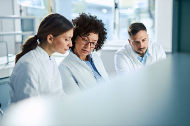 istock Team of chemists working on a new research 2198746887