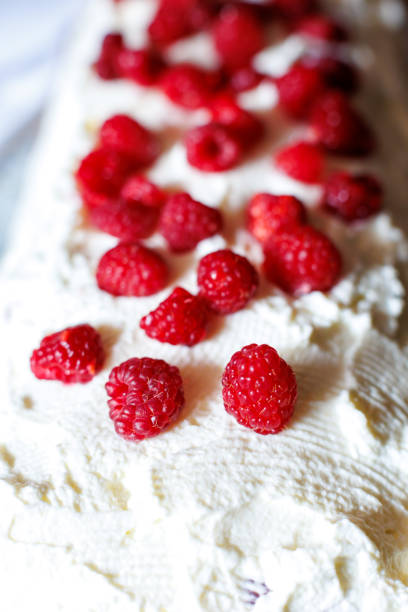 istock Delightful dessert topped with fresh raspberries on a creamy layer 2198747947