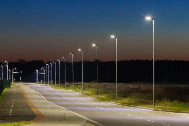 istock night empty road with modern led street lights in industrial zone 2198750392