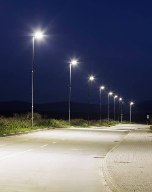 istock ight empty road with modern led street lights in industrial zone 2198750537