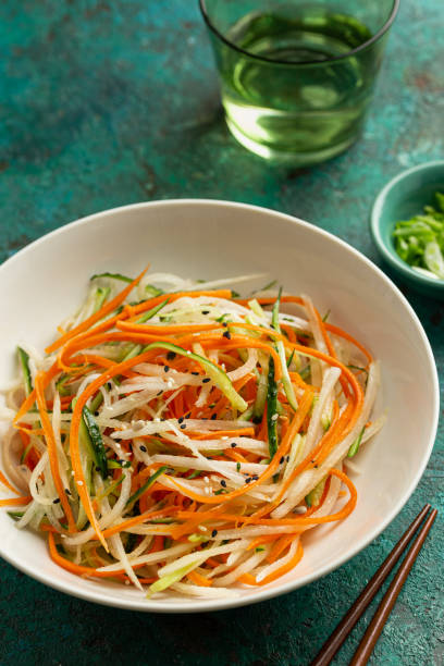 istock cucumber, carrot and daikon radish salad 2198750595