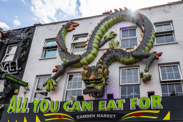 Discover Camden Town London with this bold dragon storefront, a quirky representation of city art and alternative culture. London, UK, 8 July 2023