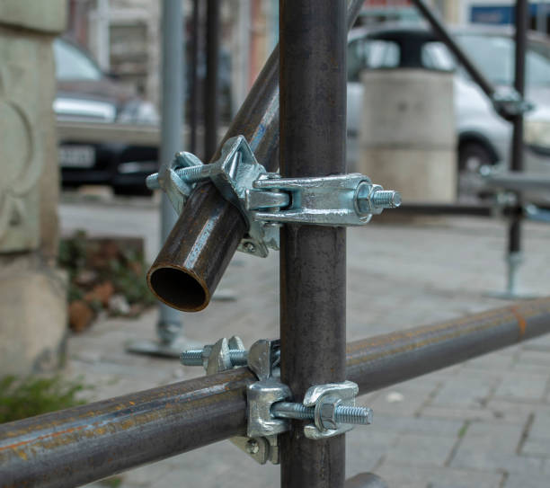 Two new scaffold double fix clamp and scaffold pipes for build the temporary structure close up