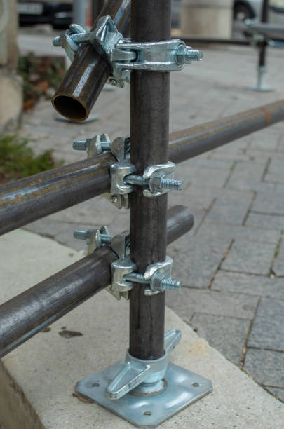 istock Three new scaffold double fix clamp and scaffold pipes for build the temporary structure 2198750856