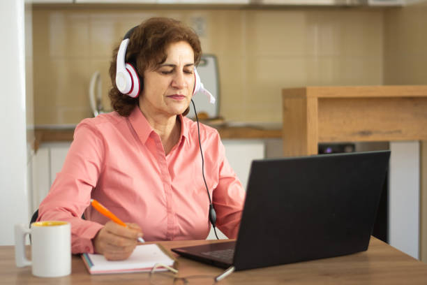 istock Older woman working on laptop 2198755381