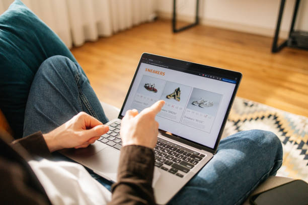 istock Unrecognizable Man Shopping for Sneakers Online at Home 2198755385