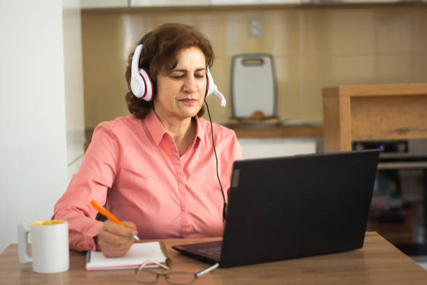 istock Older woman working on laptop 2198755407