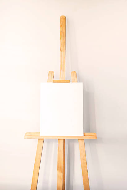 istock Blank canvas on easel ready for artistic creation in a bright, minimalist studio space 2198756061