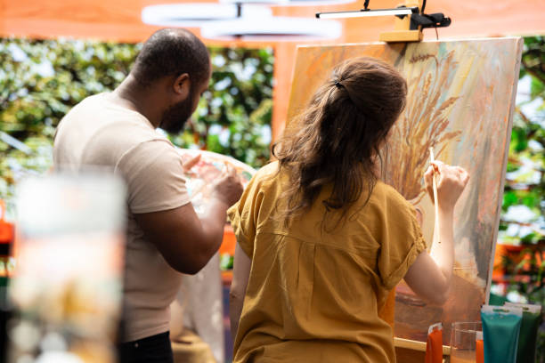 istock Team of painters recording an artistic tutorial for the internet art class 2198757703