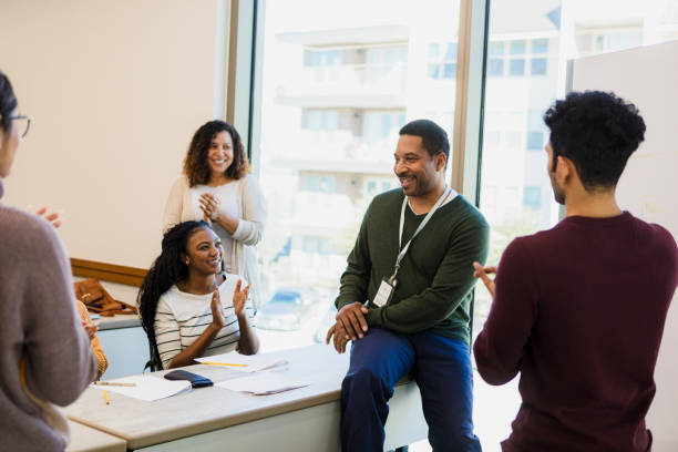 istock Diverse Group of Adults in a Classroom Setting, Engaged in Lively Discussion 2198758864