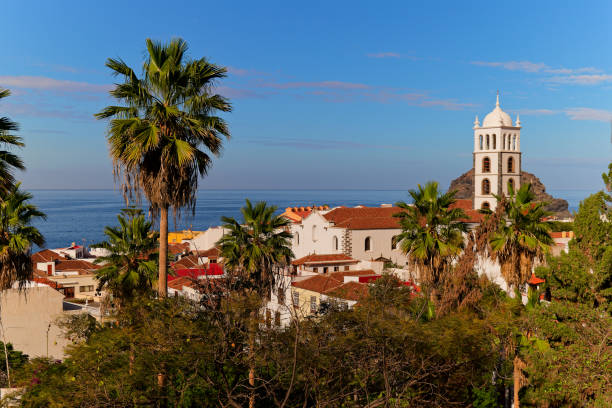 istock Garachico town with church surrounded by palm trees 2198760664