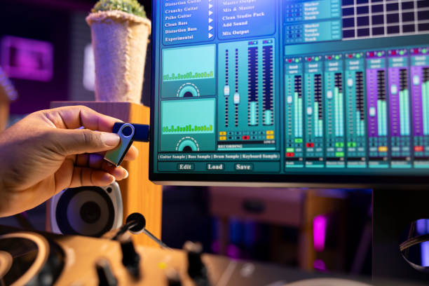 istock Sound designer copying audio recordings from an usb stick to start editing 2198761852