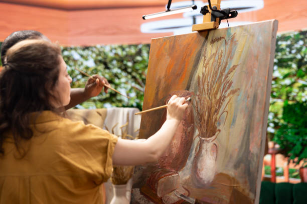 istock Diverse painters apply watercolor paint with brushstrokes for certain technique 2198762350