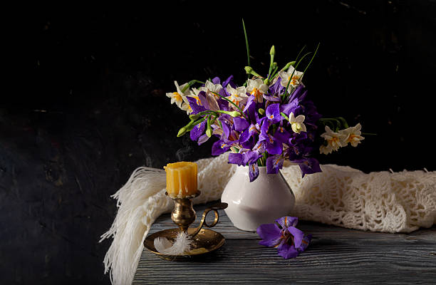 istock Still life with a bouquet of wild irises and daffodils 2198763993