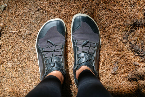 istock Legs with barefoot hiking shoes in the summer mountain 2198765632