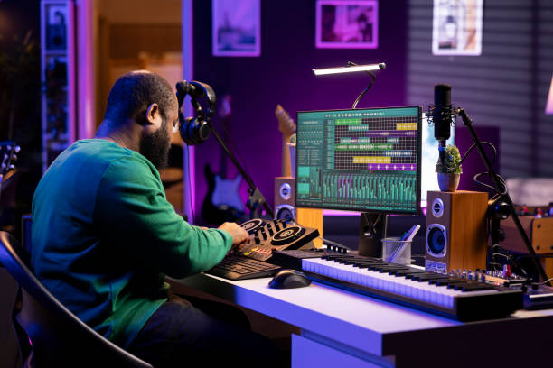istock Skilled male composer producing new songs on his mixing console 2198767584