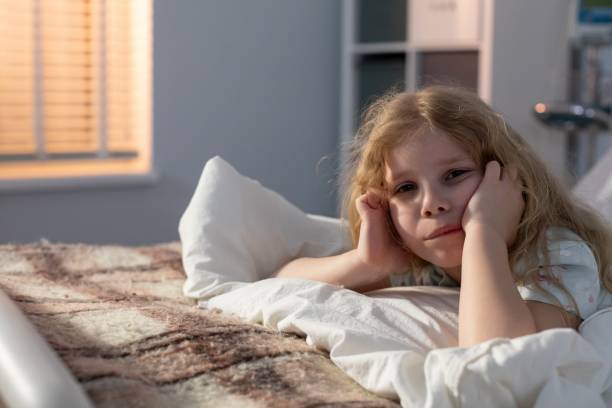 istock A Child in Bed Looking Thoughtful and Reflective at Night as the Day Comes to an End 2198767617
