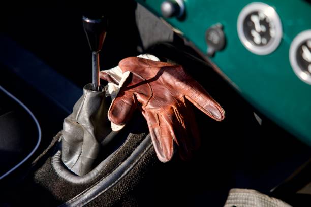 istock Leather driving gloves and sports car 2198768809