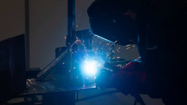 istock Competitions among welders. A man in a protective mask is welding. 2198770930