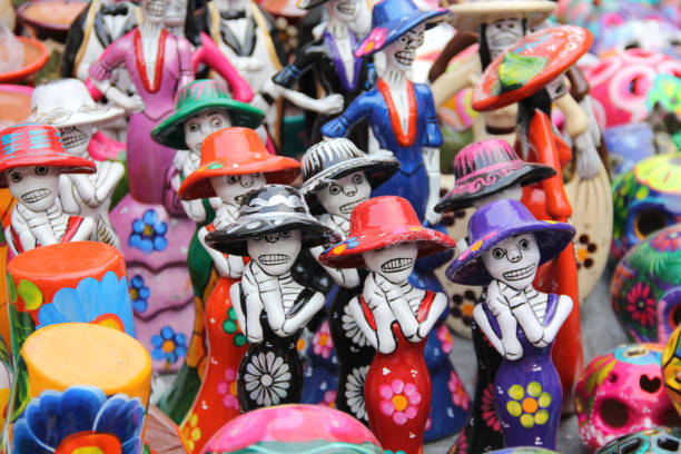 istock Day of the dead skulls, with flowers 2198774224