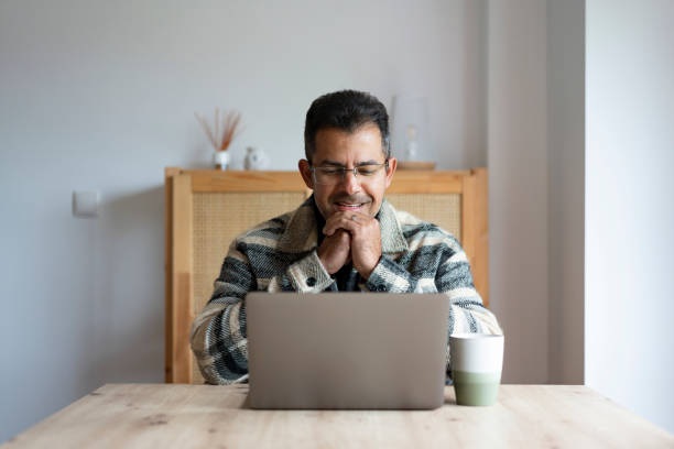 istock Businessman having online meeting on laptop 2198774290