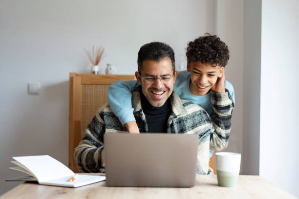 istock Father and son on online video call 2198774308