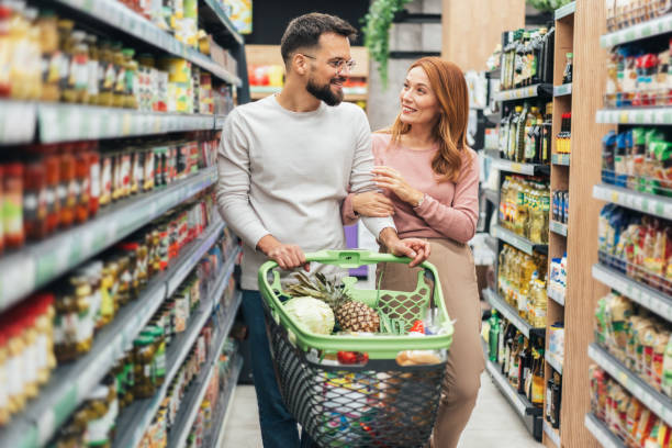 istock Couple shopping in supermarket. 2198774428