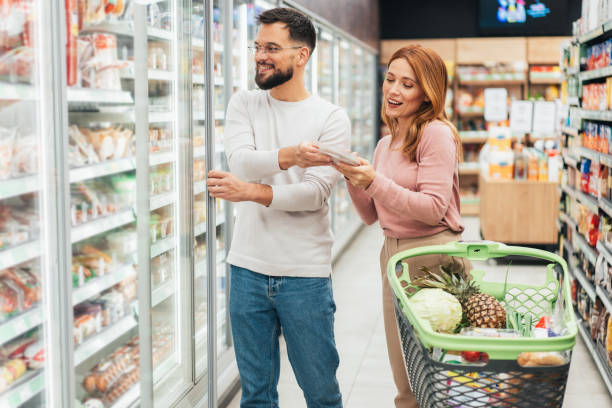 istock Couple shopping in supermarket. 2198774431