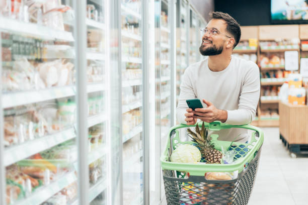 istock Handsome man shopping in supermarket 2198774432