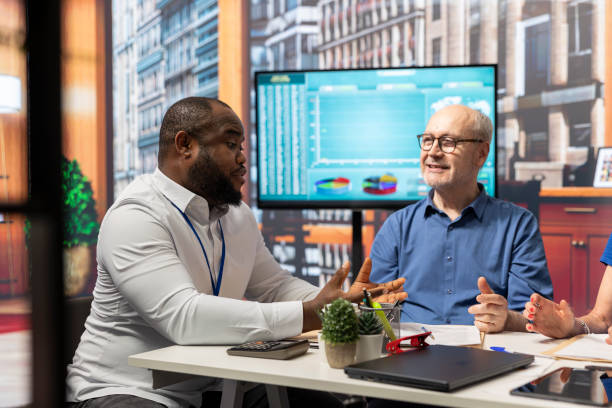 istock Old people discussing with financial advisor to explore retirement plan options 2198774453