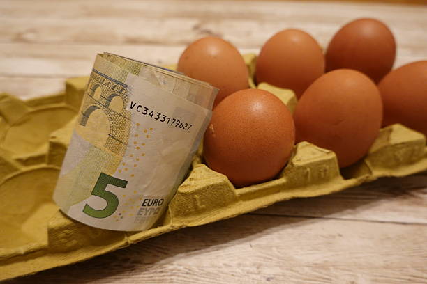 istock Rising egg prices symbolized by euro banknote in carton 2198774901
