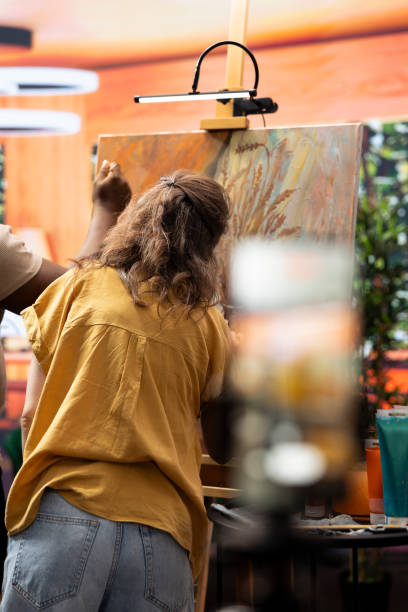 istock Skilled painters working together on an artwork in artistic workshop 2198775173