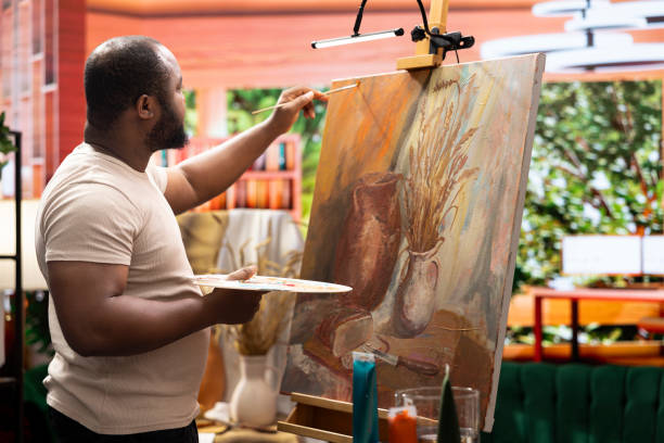 istock Painter uses a variety of brushes and paint tubes to create a masterpiece 2198777262