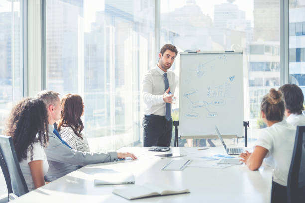 istock Businessman giving a presentation to his team. 2198777632