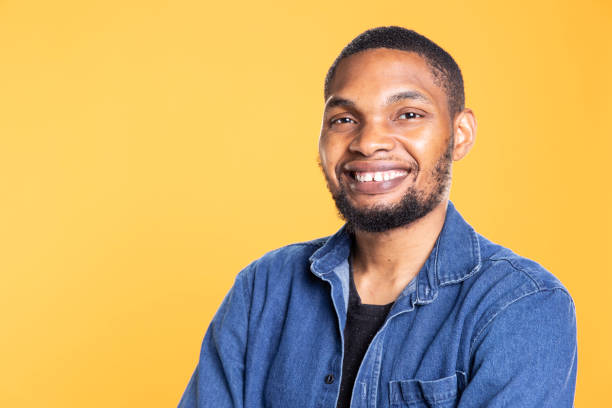 istock Portrait of charming cool african american man posing on camera 2198777659