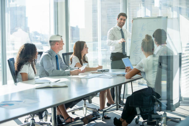 istock Businessman giving a presentation to his team. 2198777967
