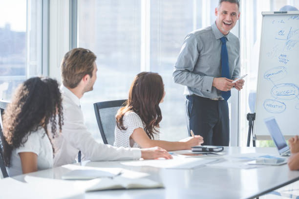 istock Businessman giving a presentation to his team. 2198778101