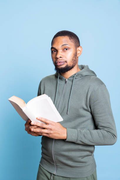 istock African american reader enjoying leisure time with a literature book 2198778444