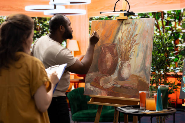 istock Painters team spend quality time on painting in their artistic studio 2198782691