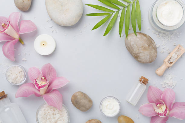 istock Composition with orchids and massage stones on color background, top view 2198782725