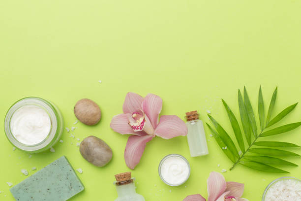 istock Composition with orchids and massage stones on color background, top view 2198782730