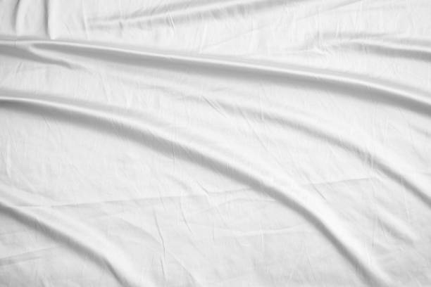 istock Abstract white wrinkled bedding sheet fabric texture background 2198785076