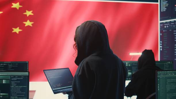 istock Chinese hacker working in governmental hacking room with Chinese flag 2198785488