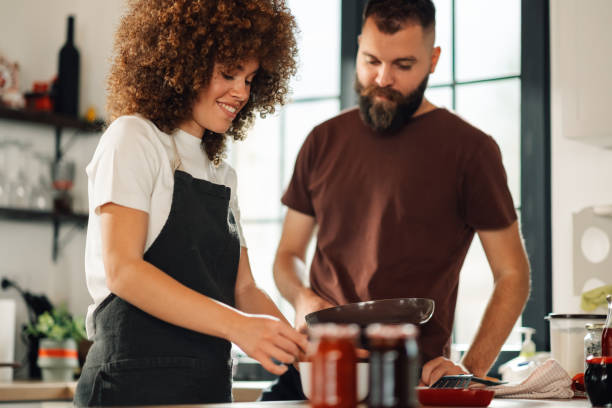 istock Chefs preparing ingredients for a recipe in a modern kitchen 2198785757