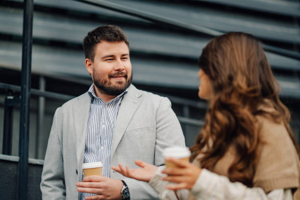 istock Businessman explaining something to colleague during coffee break 2198786156