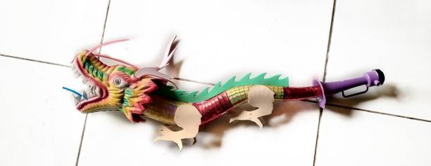 Paper-cut dragon in old instant photo frame with Year of the Dragon  in 2024