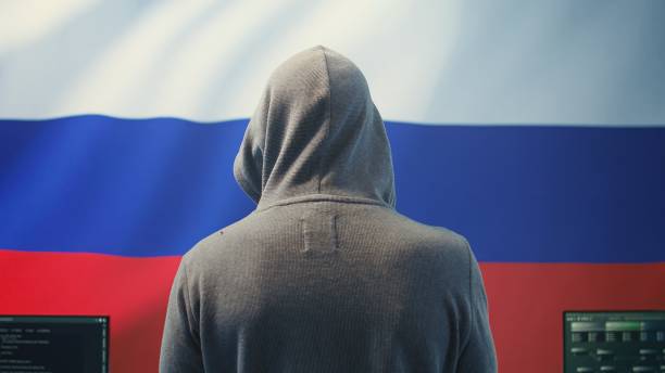 istock A Russian hacker working in a governmental hacking room with the Russian flag 2198788425