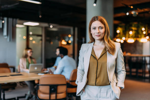 istock Confident businesswoman and her team. 2198790316