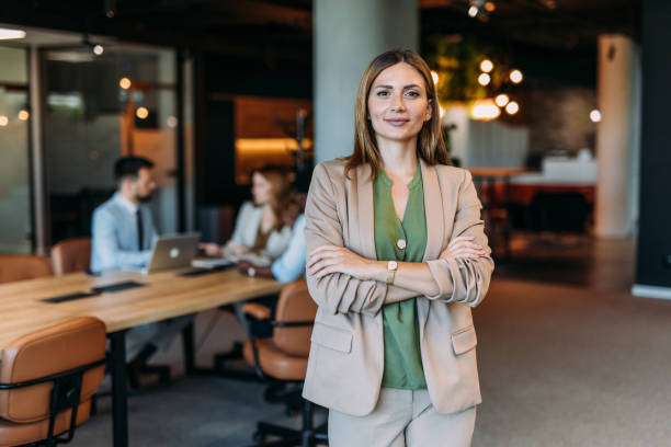 istock Confident businesswoman and her team. 2198790319
